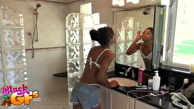 Watch this busty babe get her bald pussy licked in a steamy bathroom session