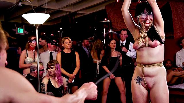 BDSM submissive public slut whipped in front voyeurs