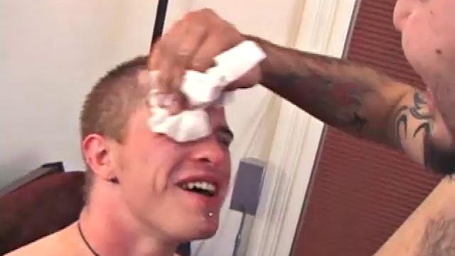 Straight boy Rock and gay boy Chase massage their cocks while watching a porn video. Chase leans over to suck Rock's hard cock. Rock loves it so much that he nuts all over Chase's face. Rock isn't finished yet, though.