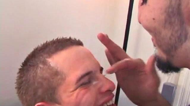 Straight boy Rock and gay boy Chase massage their cocks while watching a porn video. Chase leans over to suck Rock's hard cock. Rock loves it so much that he nuts all over Chase's face. Rock isn't finished yet, though.