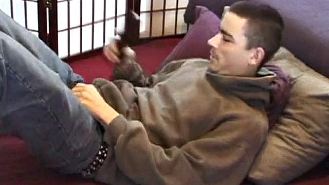 Dan's clothes quickly disappear and he pumps steadily with his left hand, showing off the two stars tattooed on his forearm. Lubrication enhances Dan's serious stroke session.