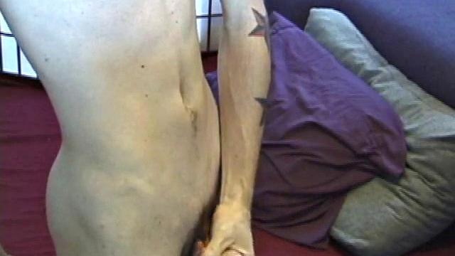 Dan's clothes quickly disappear and he pumps steadily with his left hand, showing off the two stars tattooed on his forearm. Lubrication enhances Dan's serious stroke session.