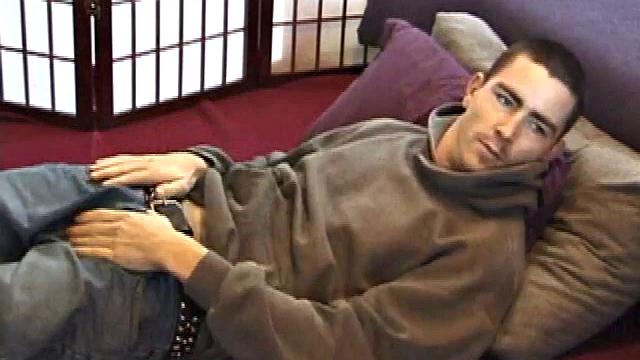 Dan's clothes quickly disappear and he pumps steadily with his left hand, showing off the two stars tattooed on his forearm. Lubrication enhances Dan's serious stroke session.