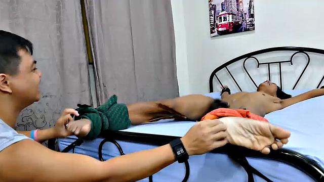 Clark is a newcomer and boy is he a slim sexy Asian twink! Best of all, he's really ticklish! This Asian boy is spreadeagled while Vahn and I tickle his soft, smooth soles with feathers, fingers, some homemade finger points, and a hairbrush.