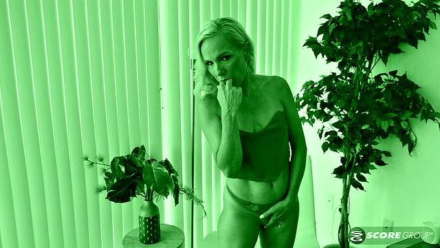 A petite blonde named Bella bares her body