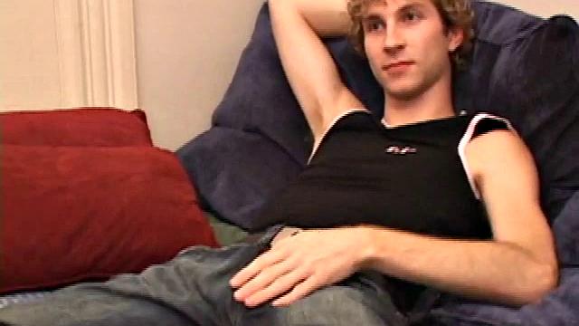 Amateur Jenson McGill rubs his crotch while watching porn, strips off clothes to stroke stiff cock & cum on face