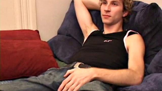 Amateur Jenson McGill rubs his crotch while watching porn, strips off clothes to stroke stiff cock & cum on face