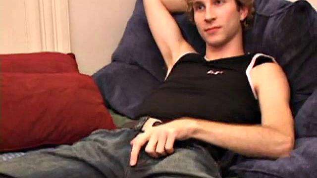 Amateur Jenson McGill rubs his crotch while watching porn, strips off clothes to stroke stiff cock & cum on face