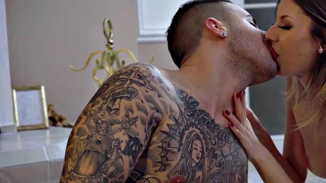 Watch this tattooed blonde teen in lingerie play with her pussy before getting fucked doggystyle in the living room