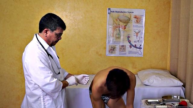 Asian twink takes enema at the doctor's office after anal toy