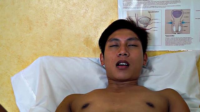 Asian twink takes enema at the doctor's office after anal toy