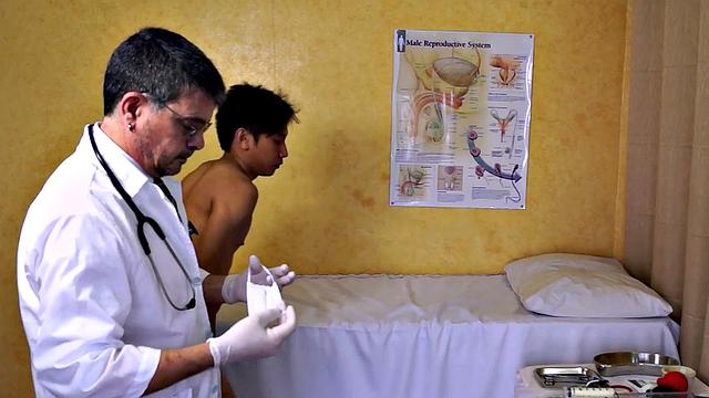 Asian twink takes enema at the doctor's office after anal toy