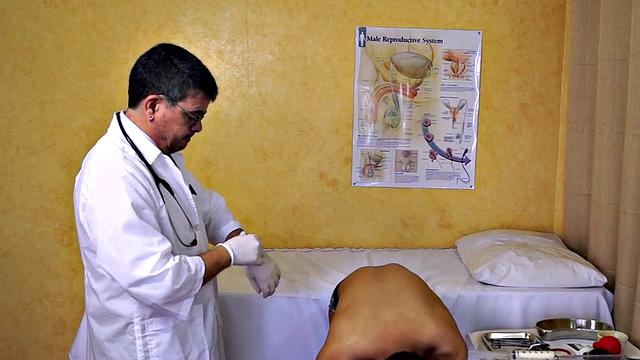 Asian twink takes enema at the doctor's office after anal toy