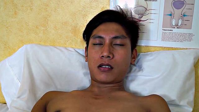 Asian twink takes enema at the doctor's office after anal toy