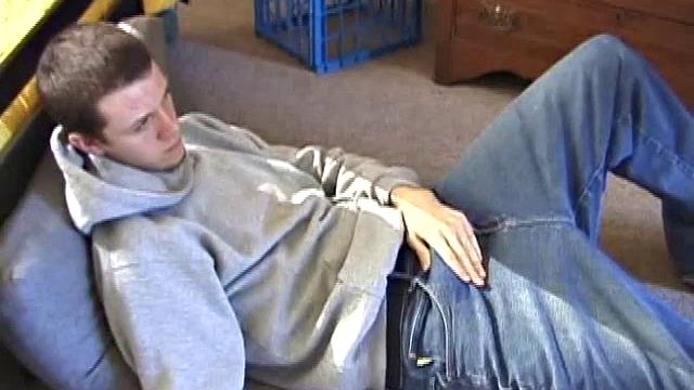 After using the remote to cue up a porn video, young Derek massages his crotch and wakes up his monster. Once the clothes are off, he starts to stroke and it doesn't take long for Derek to cum all over his hairy tummy.