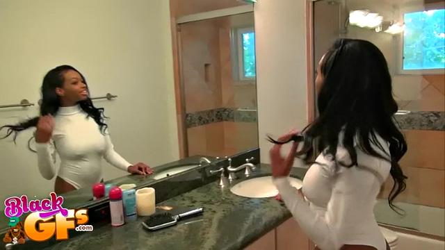 Brunette bombshells with big tits give head in the bathroom