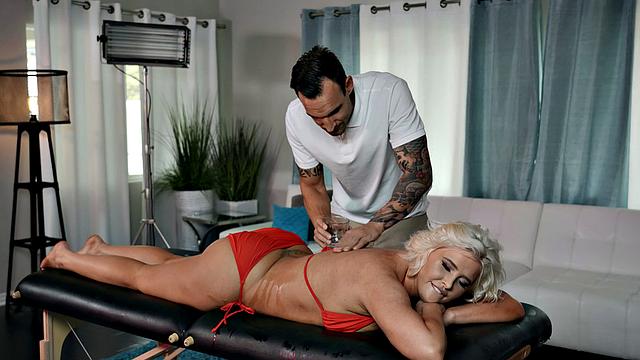 Blonde bombshell Shannon Silhouette gets oiled up and reverse cowgirl fucked in the living room