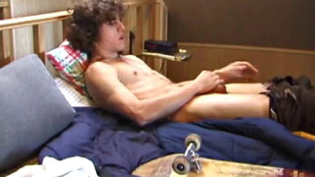 With his skateboard at his side, this young street surfer wastes little time sliding down his pants and pulling out his rock hard cock. With the underwear off, Adam grabs a dildo, raises his legs into the air, and shoves it up his ass.