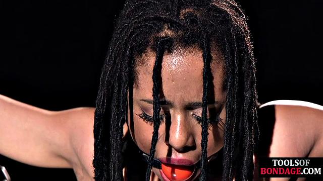Mouthgagged Ebony anally toyed by maledom