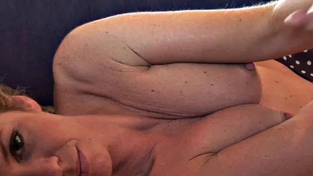 Busty Leila touches herself