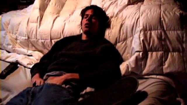 Jayden works his cock with his hand while gyrating hips, lifting legs high for added stimulation and close-up views.