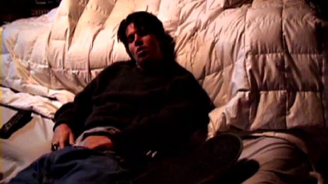 Jayden works his cock with his hand while gyrating hips, lifting legs high for added stimulation and close-up views.