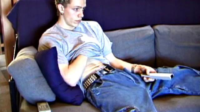 Shane relaxes on the sofa, while watching a porn video and gets totally into himself. He works his lubed up cock with determination and pumps out a big cum gusher.