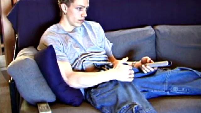 Shane relaxes on the sofa, while watching a porn video and gets totally into himself. He works his lubed up cock with determination and pumps out a big cum gusher.