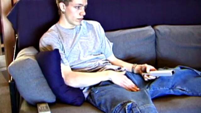 Shane relaxes on the sofa, while watching a porn video and gets totally into himself. He works his lubed up cock with determination and pumps out a big cum gusher.