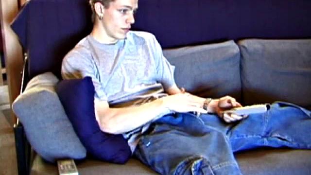 Shane relaxes on the sofa, while watching a porn video and gets totally into himself. He works his lubed up cock with determination and pumps out a big cum gusher.