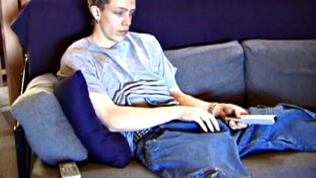 Shane relaxes on the sofa, while watching a porn video and gets totally into himself. He works his lubed up cock with determination and pumps out a big cum gusher.