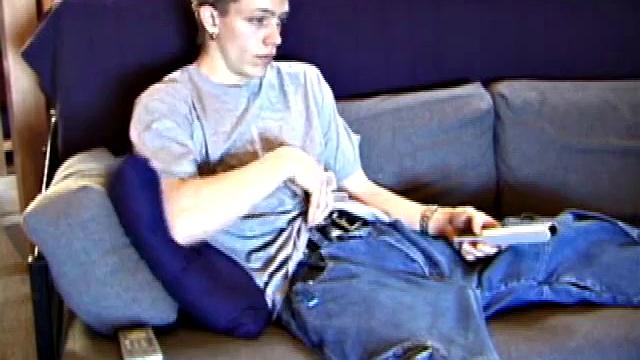 Shane relaxes on the sofa, while watching a porn video and gets totally into himself. He works his lubed up cock with determination and pumps out a big cum gusher.