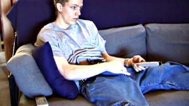 Shane relaxes on the sofa, while watching a porn video and gets totally into himself. He works his lubed up cock with determination and pumps out a big cum gusher.
