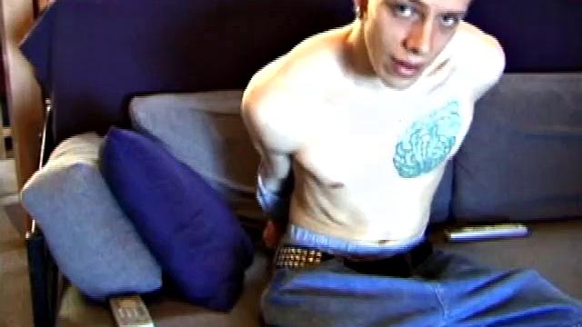 Shane relaxes on the sofa, while watching a porn video and gets totally into himself. He works his lubed up cock with determination and pumps out a big cum gusher.