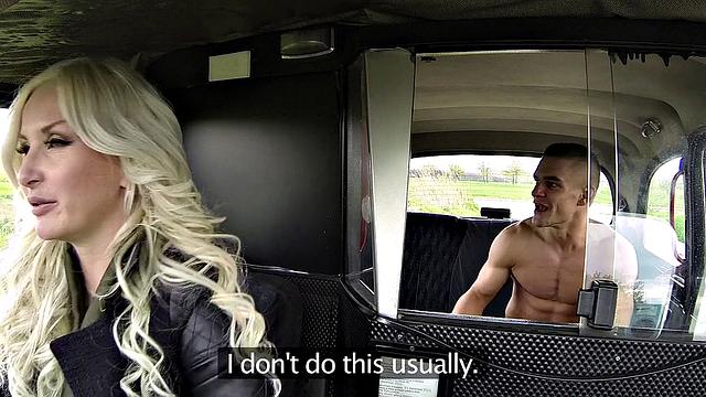 Blonde bombshell with huge tits goes wild on her passenger's hard rod