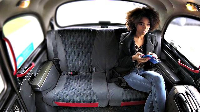 Curly-haired ebony stunner rides a big dick in jeans & car