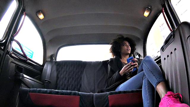 Curly-haired ebony stunner rides a big dick in jeans & car