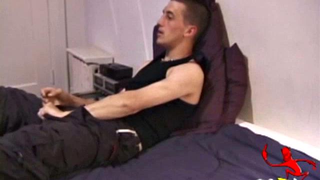 Zeek is a laid back kind of guy and he's getting a boner in his pants. Once he's hard he pulls off his pants, but keeps the shirt on. The first thing we see is this boy is packing a huge dick and he goes right to work on it.