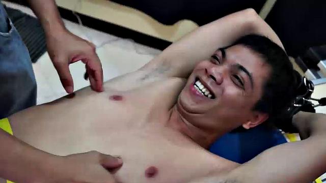 Diamond collectors have captured a thief who's been stealing diamonds from them. They've strapped him down on a rack and intend to tickle the cute young Asian boy until he breaks. They've got all day if necessary.