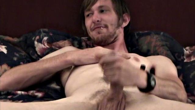 In this homemade video, skinny Eugene is ready on the bed to beat off. By the time he's naked, that big dick is rock hard and ready to play with.