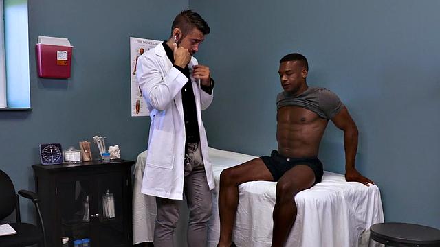 Sixpack patient breeded by sturdy doctor in office