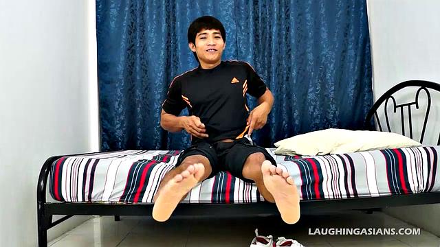 One of our most popular str8 Asian tickle boys goes solo to show off his Asian boy feet. He strips off his white Nike's and gives himself a little foot tickle.