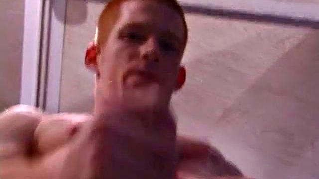 Tristian grabs his balls and strokes his long cock with determination. He kneels down before us and sticks his cock in the camera. Standing back up, Tristian continues to jerk off, until he asks if we want it on our face.