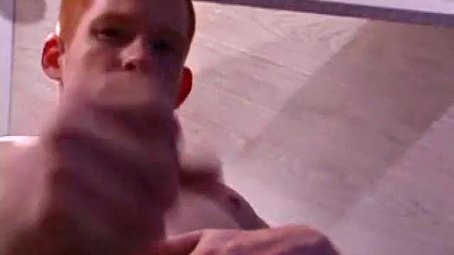 Tristian grabs his balls and strokes his long cock with determination. He kneels down before us and sticks his cock in the camera. Standing back up, Tristian continues to jerk off, until he asks if we want it on our face.