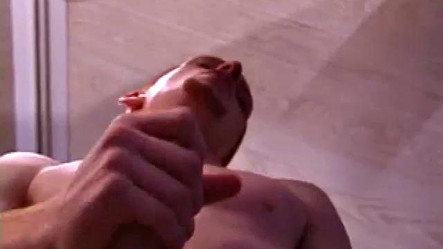 Tristian grabs his balls and strokes his long cock with determination. He kneels down before us and sticks his cock in the camera. Standing back up, Tristian continues to jerk off, until he asks if we want it on our face.