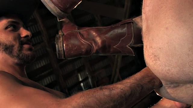 Cowboy in boots fists BFs ass on hay in stable