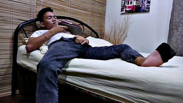 This cute young Asian twink loves the odor of his shoes after wearing them all day long. Jude slips off his Nikes and takes a long sniff of his shoe before rubbing it on his hard cock.