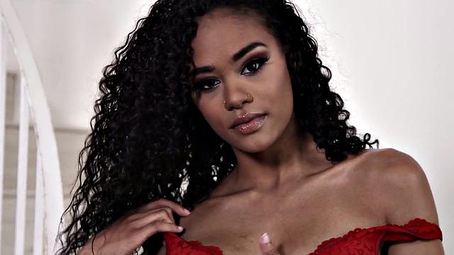 Curly-haired ebony babe with a pierced pussy gets pounded doggystyle after giving head to hung partner