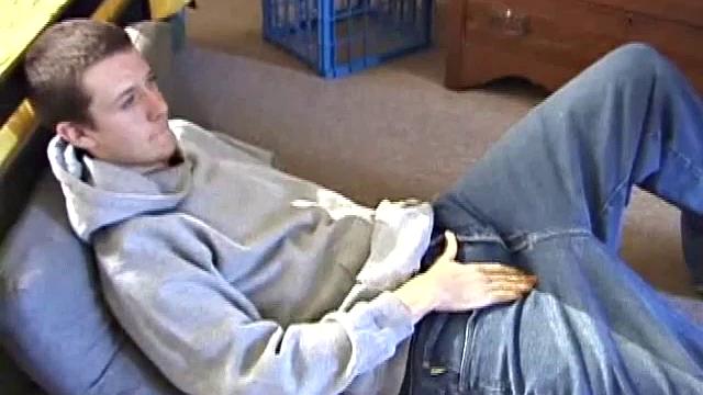 After using the remote to cue up a porn video, Derek massages his crotch to wake up his monster. Once the clothes are off he starts to stroke and it doesn't take long for Derek to cum all over his hairy stomach.