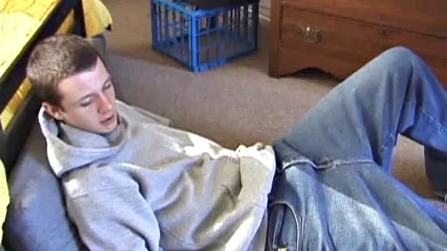 After using the remote to cue up a porn video, Derek massages his crotch to wake up his monster. Once the clothes are off he starts to stroke and it doesn't take long for Derek to cum all over his hairy stomach.